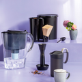 Tupperware Kaffeehaus schwarz Gedeckte Tafel mit Thermoskanne, Wasserfilter Kanne und Kaffeebehälter